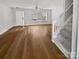 Bright living room features hardwood floors, a ceiling fan, and a window with natural light at 6457 Saint Bernard Way, Charlotte, NC 28269