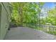 A large outdoor deck overlooks a well-maintained, lush green backyard at 6609 Pleasant Dr, Charlotte, NC 28211