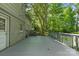 A spacious deck offering a view of the home's exterior and the lush backyard at 6609 Pleasant Dr, Charlotte, NC 28211