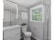 A modern bathroom showcasing a sleek vanity, a toilet and a stand up shower at 6609 Pleasant Dr, Charlotte, NC 28211