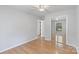 This bedroom has hardwood floors and a mirrored closet at 6609 Pleasant Dr, Charlotte, NC 28211
