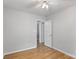 Neutral bedroom offers a serene and inviting space, featuring hardwood floors and ample natural light at 6609 Pleasant Dr, Charlotte, NC 28211