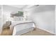 A bright bedroom featuring neutral walls, and a stylish headboard with views from a window at 6609 Pleasant Dr, Charlotte, NC 28211