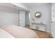 A lovely bedroom featuring neutral decor, a console table, and a decorative mirror at 6609 Pleasant Dr, Charlotte, NC 28211