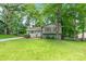 Lovely two-story home with mature trees and a well-maintained lawn at 6609 Pleasant Dr, Charlotte, NC 28211