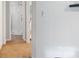 Hallway leads to a bathroom with a glass-enclosed shower, offering a clean and functional design at 6609 Pleasant Dr, Charlotte, NC 28211