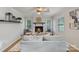 Cozy living room with a brick fireplace, creating a warm and inviting atmosphere for gatherings at 6609 Pleasant Dr, Charlotte, NC 28211