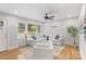 Inviting living room with hardwood floors, stylish decor, and a ceiling fan at 6609 Pleasant Dr, Charlotte, NC 28211