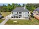 This aerial view showcases the large backyard with patio, hot tub, and a playset at 6814 Forney Hill Rd # 2, Denver, NC 28037