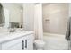 Neutral toned bathroom with white vanity, tiled shower and a modern design at 6814 Forney Hill Rd # 2, Denver, NC 28037