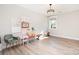 Versatile bonus room featuring neutral walls, durable flooring, and natural light from the window at 6814 Forney Hill Rd # 2, Denver, NC 28037