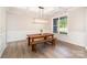 Bright dining room showcasing a wooden table with benches and modern lighting, perfect for Gathering meals at 6814 Forney Hill Rd # 2, Denver, NC 28037