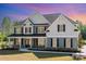 Gorgeous two-story home with a covered front porch, complemented by beautiful landscaping and a serene atmosphere at 6814 Forney Hill Rd # 2, Denver, NC 28037