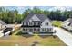 Attractive home with a well-manicured lawn, featuring a covered front porch and spacious driveway at 6814 Forney Hill Rd # 2, Denver, NC 28037
