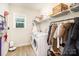 Functional laundry room includes modern appliances, shelving, and space for storage and organization at 6814 Forney Hill Rd # 2, Denver, NC 28037