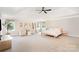 Spacious main bedroom featuring neutral colors, plush carpet, and plenty of natural light from large windows at 6814 Forney Hill Rd # 2, Denver, NC 28037