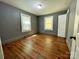 This bedroom features hardwood floors and natural light from the windows at 736 7Th Sw Ave, Hickory, NC 28602
