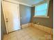 This laundry room features tile floors and a window for natural light at 736 7Th Sw Ave, Hickory, NC 28602
