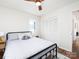 Bedroom features a ceiling fan, hardwood floors, natural light, and neutral walls at 7728 Babe Stillwell Farm Rd, Huntersville, NC 28078