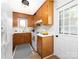 Functional kitchen with wooden cabinets, white countertops, and standard appliances at 7728 Babe Stillwell Farm Rd, Huntersville, NC 28078