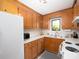 Functional kitchen with wooden cabinets, white countertops, and standard appliances at 7728 Babe Stillwell Farm Rd, Huntersville, NC 28078