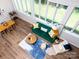 Bright, airy living room with wood floors, large windows, and contemporary furnishings at 7728 Babe Stillwell Farm Rd, Huntersville, NC 28078