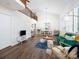 Bright living room features wood floors, vaulted ceilings and an open floor plan at 7728 Babe Stillwell Farm Rd, Huntersville, NC 28078