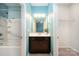 This bathroom features a vanity with dark wood cabinets, a shower-tub combo, and access to the bedroom and closet at 8268 Breton Way, Harrisburg, NC 28075