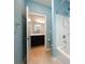 This bathroom features a vanity with dark wood cabinets and a shower-tub combo at 8268 Breton Way, Harrisburg, NC 28075