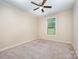 Bedroom featuring neutral walls, ceiling fan, and carpet flooring, with ample natural light at 8268 Breton Way, Harrisburg, NC 28075