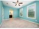 This secondary bedroom features two windows, a ceiling fan, and an attached bathroom at 8268 Breton Way, Harrisburg, NC 28075