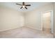 Bright bedroom featuring neutral walls, ceiling fan, carpet floors and closet space at 8268 Breton Way, Harrisburg, NC 28075