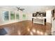 Open floor plan kitchen featuring stainless steel appliances, center island, and hardwood floors at 8268 Breton Way, Harrisburg, NC 28075