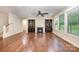 Inviting living room featuring a fireplace, built-in shelving, and large windows at 8268 Breton Way, Harrisburg, NC 28075
