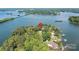 Breathtaking aerial view of a lakefront property on Lake Norman, surrounded by mature trees at 9115 Clement Cir, Terrell, NC 28682