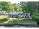 Rear view of lakeside home with a private deck and stone retaining wall at 9115 Clement Cir, Terrell, NC 28682