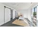 Bedroom featuring a sliding barn door and access to the outdoor deck at 9115 Clement Cir, Terrell, NC 28682