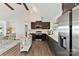 Beautiful kitchen featuring stainless appliances, an island, vaulted ceiling and hardwood floors at 9115 Clement Cir, Terrell, NC 28682