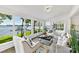 Spacious living room with lake views through large windows and stylish, modern furniture at 9115 Clement Cir, Terrell, NC 28682