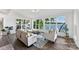 Bright living room featuring comfortable seating and picturesque lake views at 9115 Clement Cir, Terrell, NC 28682