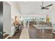 Bright living room with hardwood floors, vaulted ceiling and expansive lake views from large windows at 9115 Clement Cir, Terrell, NC 28682