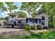 Back of house with a multi-tiered deck overlooking a tree lined yard, perfect for outdoor living and entertaining at 9115 Clement Cir, Terrell, NC 28682
