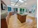 Gourmet kitchen with hardwood floors, custom cabinets, and an oversized island at 9116 Torrence Creek Ct, Huntersville, NC 28078