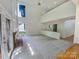 Bright open living room with a fireplace, soaring ceilings, and ample natural light at 9116 Torrence Creek Ct, Huntersville, NC 28078