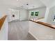 Bright open living room with fresh paint, updated carpet, and ample natural light at 9116 Torrence Creek Ct, Huntersville, NC 28078