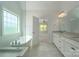 Open bathroom layout featuring freestanding tub, walk in shower, and dual vanity at 104. Wilharr Ct # 40, Mooresville, NC 28115