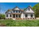 Charming two-story home boasts a landscaped yard, neutral paint, and dark shutters at 104. Wilharr Ct # 40, Mooresville, NC 28115