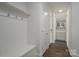 Hallway with bench, hooks, storage and dark hardwood flooring at 104. Wilharr Ct # 40, Mooresville, NC 28115