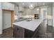 Spacious kitchen with large island, stainless appliances, and pendant lighting at 104. Wilharr Ct # 40, Mooresville, NC 28115