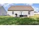 The spacious backyard features a patio, lush lawn, and a basketball hoop at 1109 Culver Spring Way, Charlotte, NC 28215